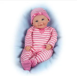 The Ashton-Drake Galleries RealTouch Vinyl Baby Doll, Pink Striped Outfit with Heart Design, Weighted Cloth Body, Blue Eyes